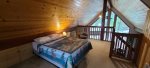 The loft has a queen bed, and a bunkbed along with a bathroom.